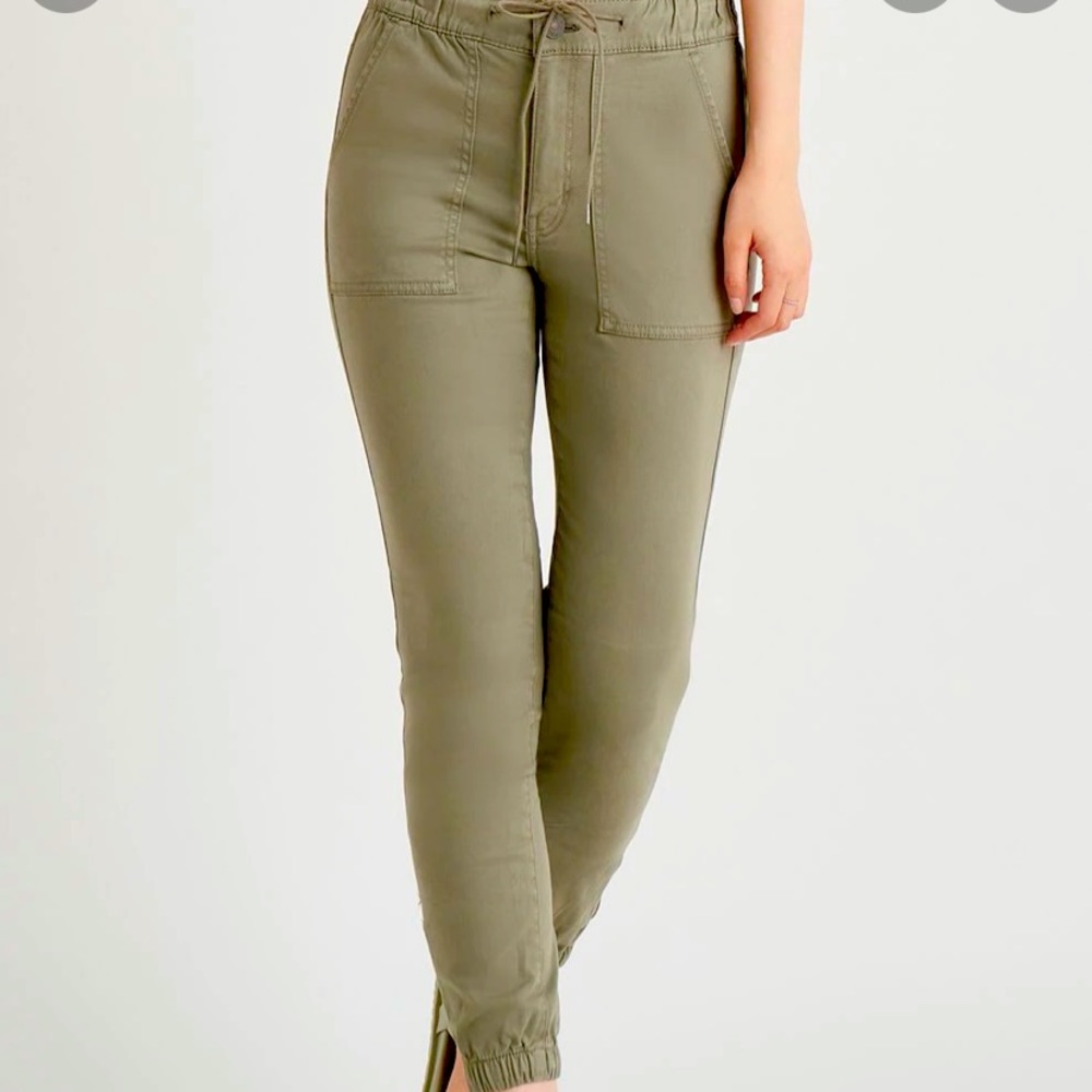 The Porscia Denim Jogger by Dex size small fits large. Will fit medium easily.
